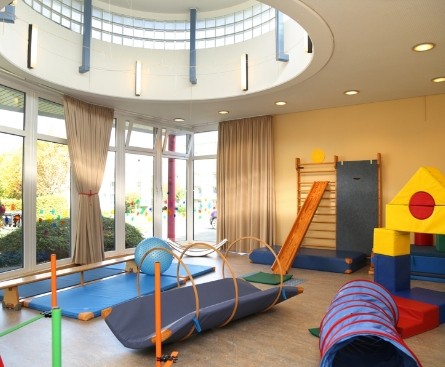 Gym with lots of play and sports equipment