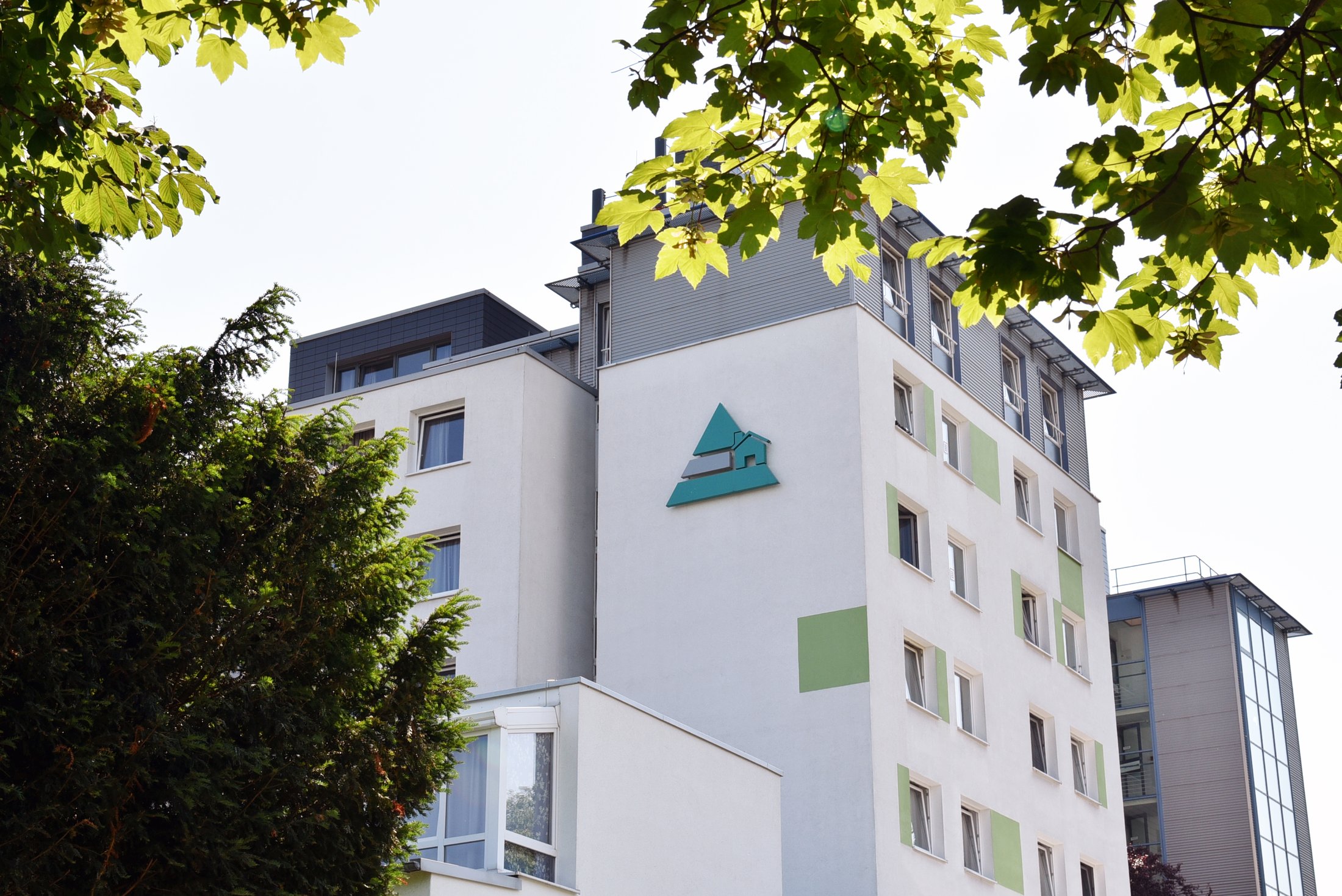 Student residence in Paderborn, Peter-Hille-Weg 11, modern architecture with green accents.